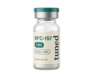 Clear glass vial with a teal cap, silver collar and cream label