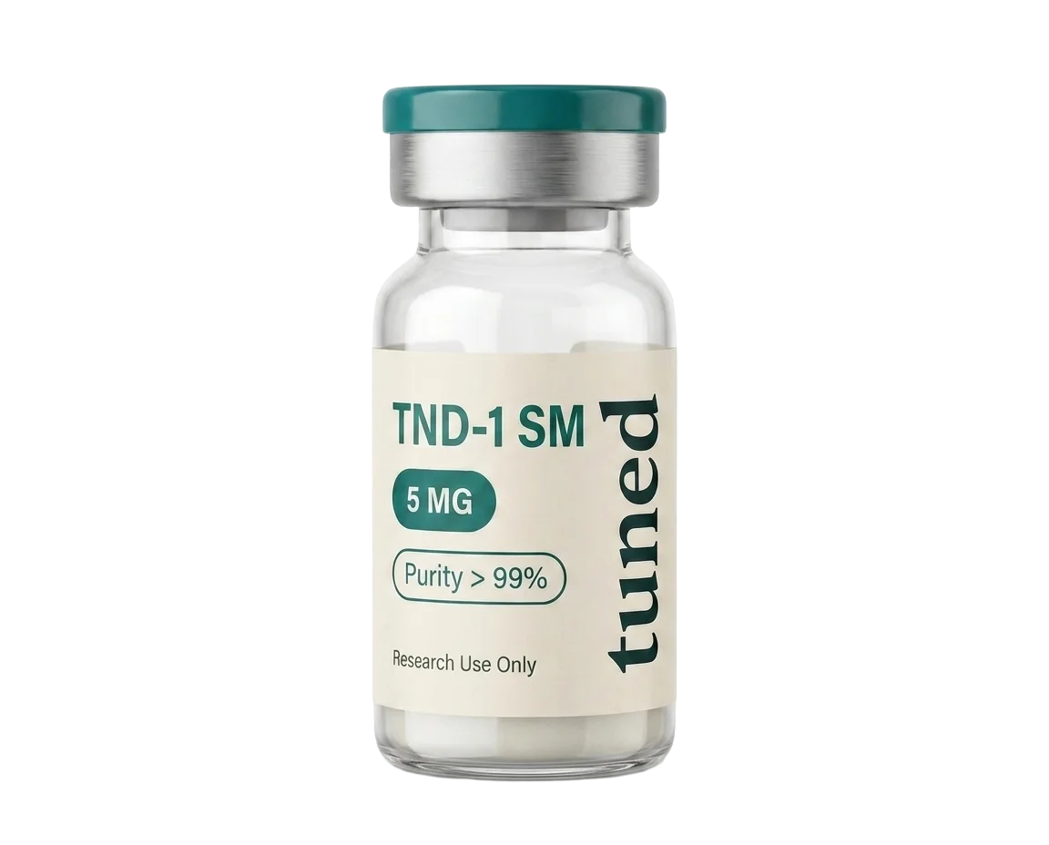 Clear glass vial with a teal cap, silver collar and cream label